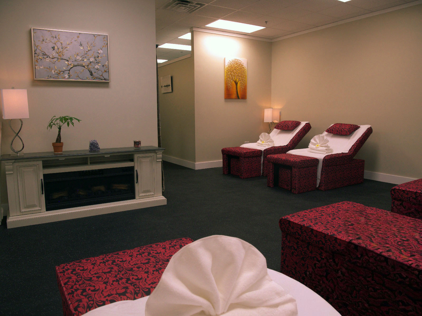 Spacious foot massage treatment area with comfortable recliners